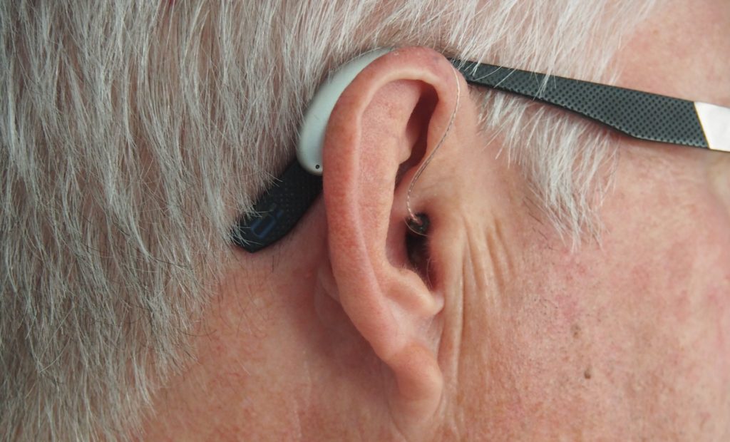 Hearing aid with glasses