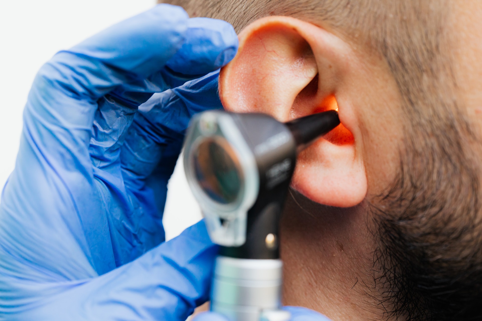 An ear inspection using an otoscope during a hearing appointment