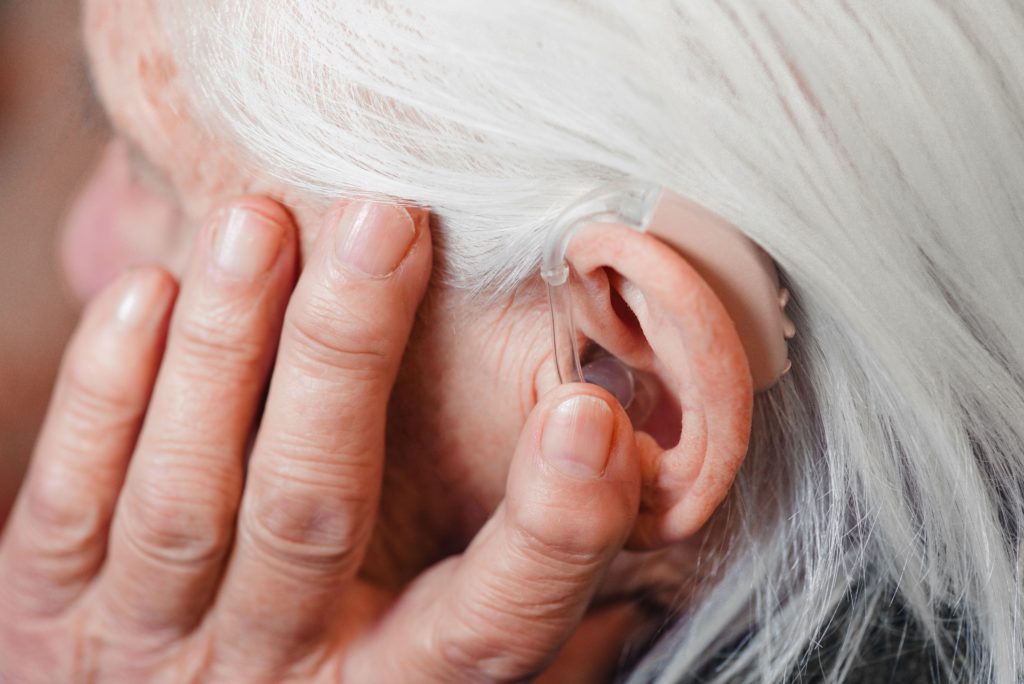 old woman with hearing loss