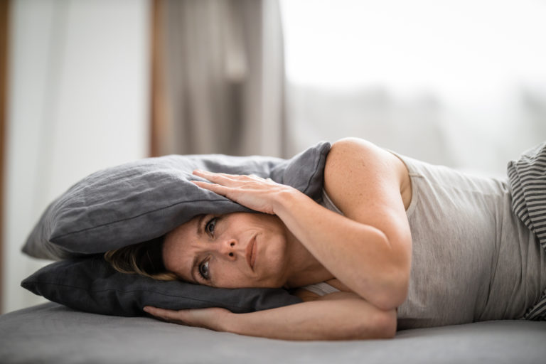 lady suffering from tinnitus