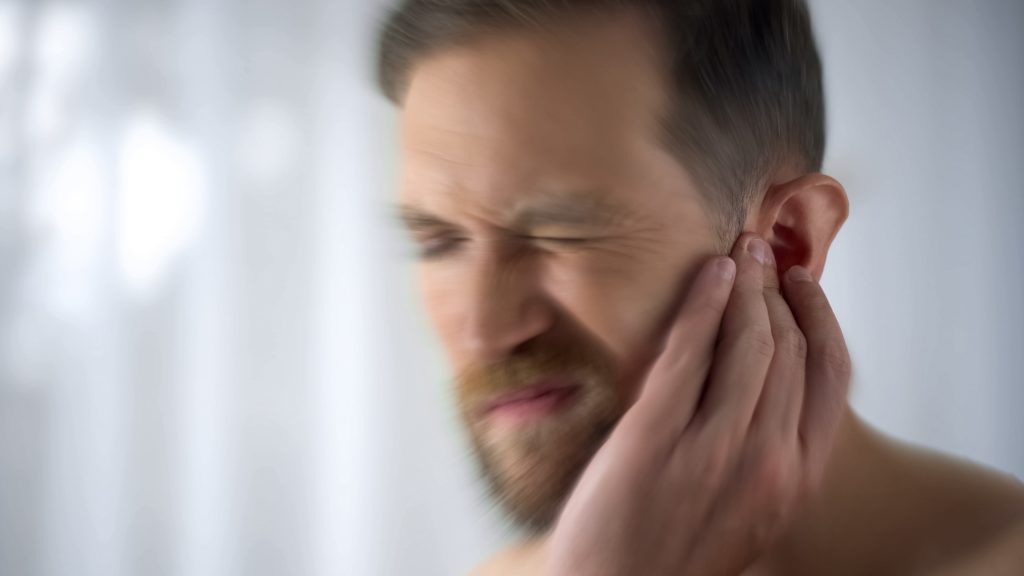 Male suffering from hearing loss