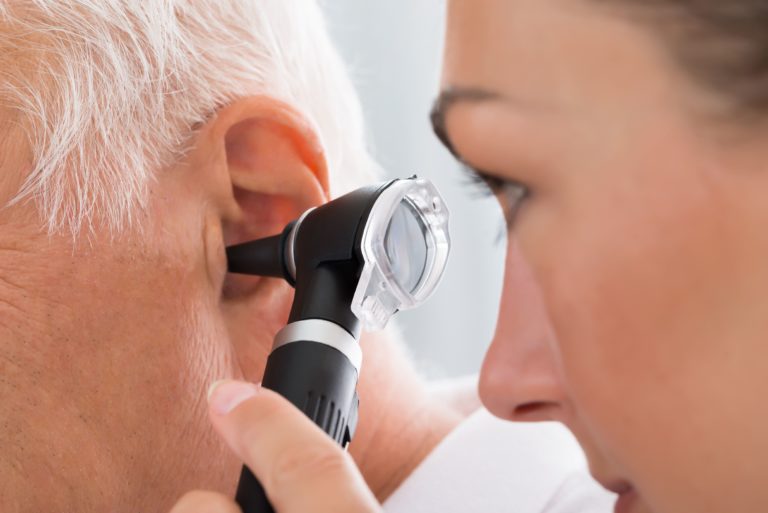 Senior man with an issue in his ear