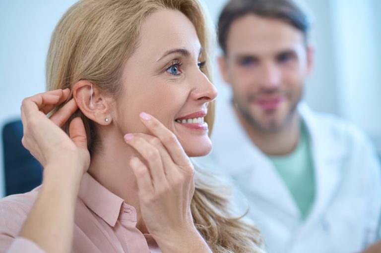 woman-adjusting-to-hearing-aids