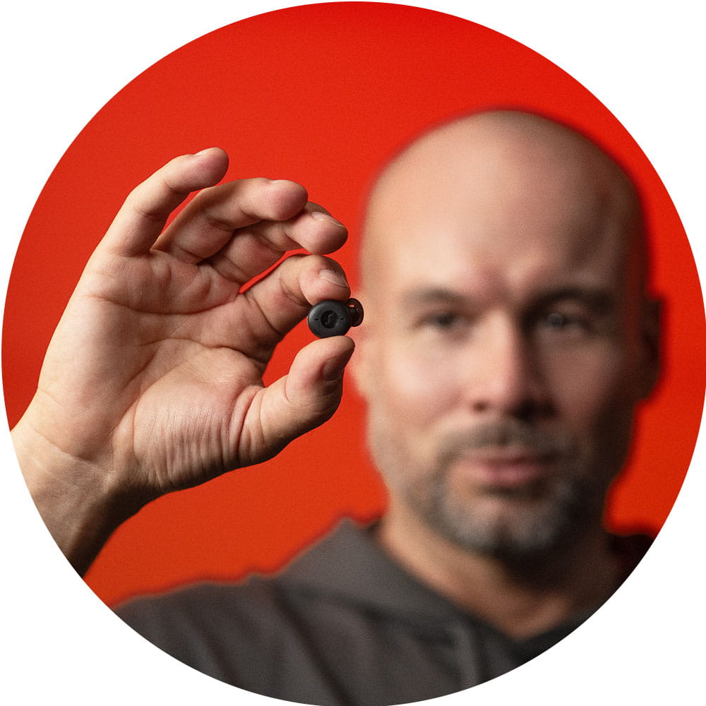 Holding the Active Pro IX earbud
